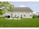 Lush backyard features a patio area, well-manicured lawn, and serene outdoor space at 5875 Mill Haven Way, Noblesville, IN 46062