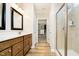 Modern bathroom features a walk-in shower, double vanity, and walk in closet at 5875 Mill Haven Way, Noblesville, IN 46062