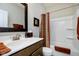 Well-lit bathroom featuring a shower-tub combo, vanity with mirror, and tasteful decorative accents at 5875 Mill Haven Way, Noblesville, IN 46062