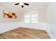 Bright bedroom with wainscoting, ceiling fan, and large window allowing natural light at 5875 Mill Haven Way, Noblesville, IN 46062