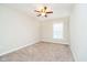 Bedroom featuring neutral carpet, a ceiling fan, and a large window at 5875 Mill Haven Way, Noblesville, IN 46062