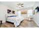 Bedroom with floral bedding, recliner, ceiling fan and lots of natural light at 5875 Mill Haven Way, Noblesville, IN 46062