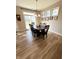 Dining room with wood table set, statement lighting, and sliding glass doors at 5875 Mill Haven Way, Noblesville, IN 46062