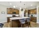 Modern kitchen with a central island, stainless steel appliances, and ample cabinet space for an efficient cooking experience at 5875 Mill Haven Way, Noblesville, IN 46062