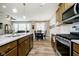 Open-concept kitchen and dining area features granite countertops and stainless steel appliances at 5875 Mill Haven Way, Noblesville, IN 46062