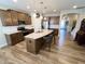 Contemporary kitchen featuring an island with pendant lighting, stainless steel appliances, and sleek countertops at 5875 Mill Haven Way, Noblesville, IN 46062