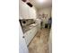 Bright laundry room features granite countertops, ample cabinet space, and washer/dryer at 5875 Mill Haven Way, Noblesville, IN 46062