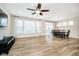 Open-concept living room with access to backyard and view into dining area at 5875 Mill Haven Way, Noblesville, IN 46062
