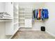Spacious walk-in closet with custom shelving and hanging rods for organized storage at 5875 Mill Haven Way, Noblesville, IN 46062