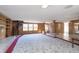 Finished basement featuring a fireplace, built-in shelves, and a spiral staircase at 5913 W Maple Dr, Frankton, IN 46044