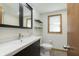 Well-lit bathroom featuring a modern vanity and mirror with neutral walls at 5913 W Maple Dr, Frankton, IN 46044