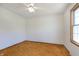 This bedroom features white walls, carpet flooring, and a bright window at 5913 W Maple Dr, Frankton, IN 46044
