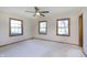 Bright bedroom featuring a ceiling fan and three windows at 5913 W Maple Dr, Frankton, IN 46044