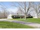 Ranch home with attached garage and well-manicured lawn at 5913 W Maple Dr, Frankton, IN 46044