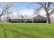 Charming ranch-style home with a well-manicured lawn and mature trees at 5913 W Maple Dr, Frankton, IN 46044