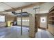 This garage features an automatic garage door, shelving, and storage at 5913 W Maple Dr, Frankton, IN 46044