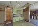 This garage has upper cabinets, a sink, and peg board for storage at 5913 W Maple Dr, Frankton, IN 46044