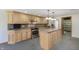 Spacious kitchen boasts a center island, stainless appliances, and ample cabinetry at 5913 W Maple Dr, Frankton, IN 46044