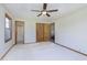 Bedroom with ceiling fan, spacious closet, and ensuite bathroom at 5913 W Maple Dr, Frankton, IN 46044