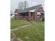 Charming one-story brick home featuring a covered front porch and classic architectural details at 6206 W Us Highway 40, Stilesville, IN 46180