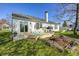 Well-maintained backyard with deck, outdoor seating, fire pit, and a lush green lawn at 6431 Meadowpond Way, Indianapolis, IN 46235