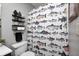 This bathroom features decorative shelving, a fish-themed shower curtain, and a comfortable toilet area at 6431 Meadowpond Way, Indianapolis, IN 46235