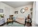 This charming Bedroom features striped walls, a rocking horse, and a cozy crib for a warm and inviting space at 6431 Meadowpond Way, Indianapolis, IN 46235
