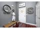 Stylish entryway with a bench, decor, and hardwood floors, offering a warm welcome at 6431 Meadowpond Way, Indianapolis, IN 46235