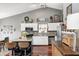 Well-appointed kitchen featuring white cabinets, modern appliances, and a stylish island with seating at 6431 Meadowpond Way, Indianapolis, IN 46235