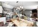 Open floor plan featuring kitchen, dining area, living room with fireplace, and hardwood floors at 6431 Meadowpond Way, Indianapolis, IN 46235