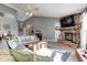 Spacious living room with a vaulted ceiling, fireplace, and comfortable seating arrangement at 6431 Meadowpond Way, Indianapolis, IN 46235
