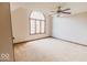 Bright bedroom featuring a large window and neutral carpeting, perfect for relaxation at 6712 Forrest Commons Blvd, Indianapolis, IN 46227