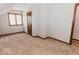 Neutral bedroom featuring a window and carpeting; great for a starter bedroom at 6712 Forrest Commons Blvd, Indianapolis, IN 46227