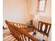 Elegant foyer with hardwood floors, chandelier, wood-trimmed staircase, and a beautiful front door at 6712 Forrest Commons Blvd, Indianapolis, IN 46227