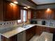 Spacious kitchen features granite countertops and stainless steel appliances at 6712 Forrest Commons Blvd, Indianapolis, IN 46227