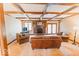 Cozy living room features a brick fireplace, plush seating, wood trim, and coffered ceilings at 6712 Forrest Commons Blvd, Indianapolis, IN 46227