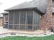 Comfortable screened-in patio with a view of a well-maintained yard, perfect for outdoor living at 6712 Forrest Commons Blvd, Indianapolis, IN 46227