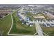 An aerial view of a meticulously planned community featuring modern homes and serene water features at 6925 Sable Point Dr, Brownsburg, IN 46112