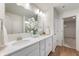 The bathroom offers a double vanity, quartz countertops, and a view to the closet at 6925 Sable Point Dr, Brownsburg, IN 46112