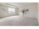 A spacious bedroom offers neutral carpeting and a large window that offers natural light at 6925 Sable Point Dr, Brownsburg, IN 46112