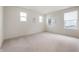 Bright bedroom featuring neutral walls, plush carpeting, and natural light from multiple windows at 6925 Sable Point Dr, Brownsburg, IN 46112