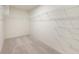 Spacious walk-in closet features carpeted floors and white shelving for optimal organization at 6925 Sable Point Dr, Brownsburg, IN 46112