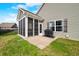 Exterior of a home with a screened in porch, patio, and lush lawn at 7574 Merrick Dr, Brownsburg, IN 46112