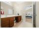 Spacious primary bathroom with a double vanity and large mirror, offering ample space at 7574 Merrick Dr, Brownsburg, IN 46112