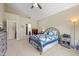 Cozy bedroom with a vaulted ceiling, carpet, and a view into the ensuite bathroom and closet at 7574 Merrick Dr, Brownsburg, IN 46112