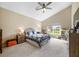Bright bedroom with vaulted ceiling, carpeted floor, and a large window offering plenty of natural light at 7574 Merrick Dr, Brownsburg, IN 46112