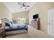 Comfortable bedroom with vaulted ceiling, carpet, and an exterior view from the large bright window at 7574 Merrick Dr, Brownsburg, IN 46112