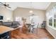 Bright dining area showcases table, chairs, hardwood flooring, and natural light at 7574 Merrick Dr, Brownsburg, IN 46112