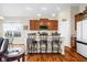 Kitchen with an island, barstool seating, wood cabinets, recessed lighting, and stainless steel appliances at 7574 Merrick Dr, Brownsburg, IN 46112