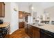 Bright kitchen featuring wood cabinets, light countertops, and stainless steel double basin sink at 7574 Merrick Dr, Brownsburg, IN 46112